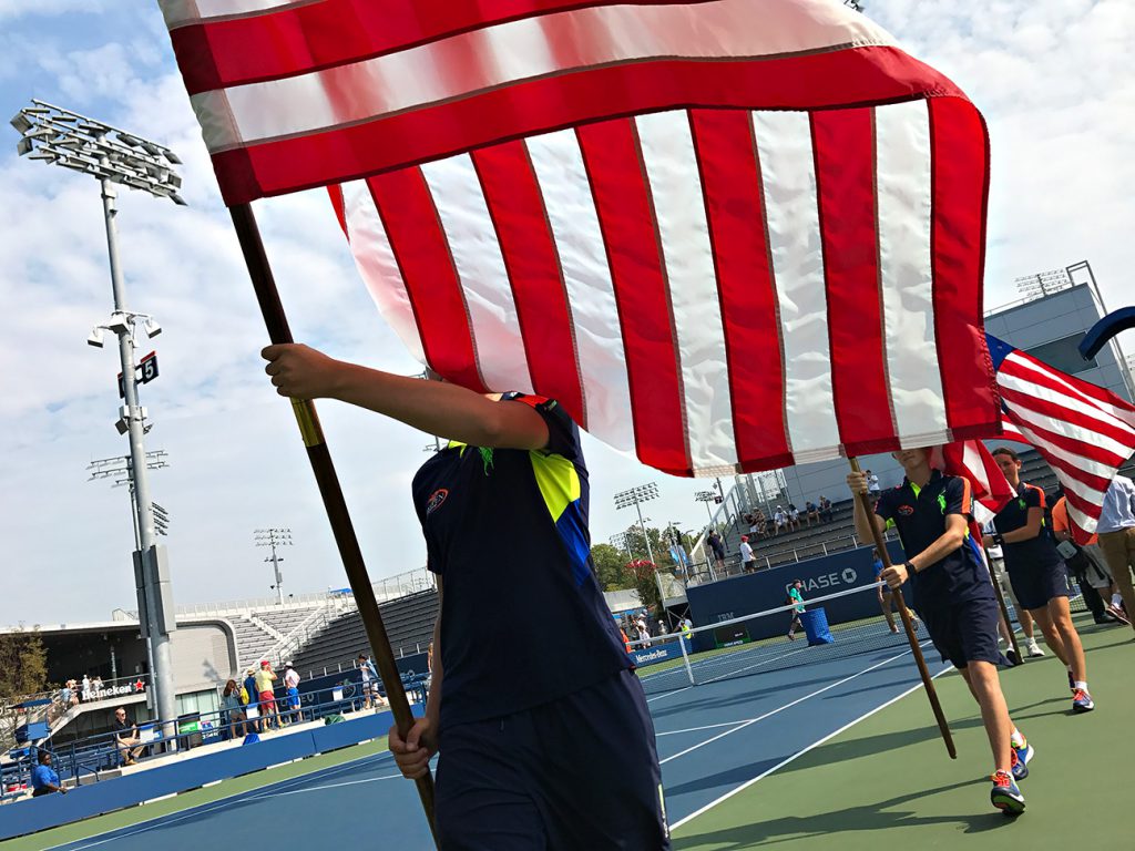 NEW YORK, NY - SEPTEMBER 10:  Flag bearers on court 5 after the Men's Collegiate Invitational on Day Thirteen of the 2016 US Open at the USTA Billie Jean King National Tennis Center on September 10, 2016 in Queens.  (Landon Nordeman for ESPN)