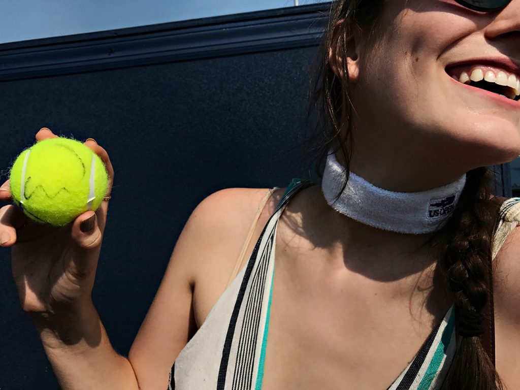 NEW YORK, NY - SEPTEMBER 10:  Lindsey Peterson, 24, an assistant buyer at Saks sports a vintage 2015 US Open Headband as a neckpiece and a tennis ball signed by Serena Williams on Day Thirteen of the 2016 US Open at the USTA Billie Jean King National Tennis Center on September 10, 2016 in Queens.  (Landon Nordeman for ESPN)